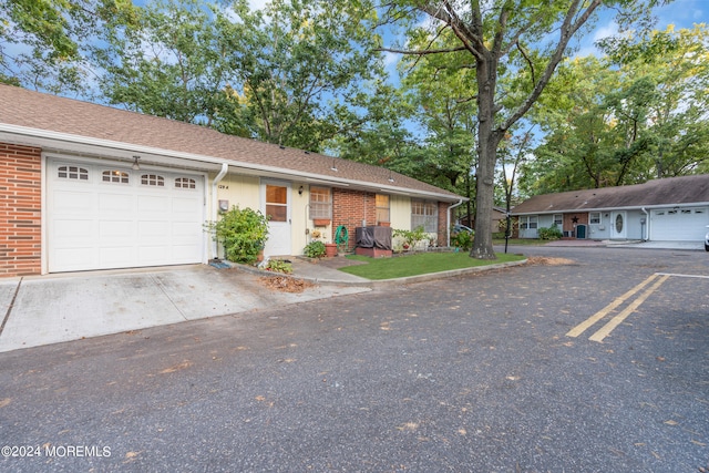 single story home with a garage