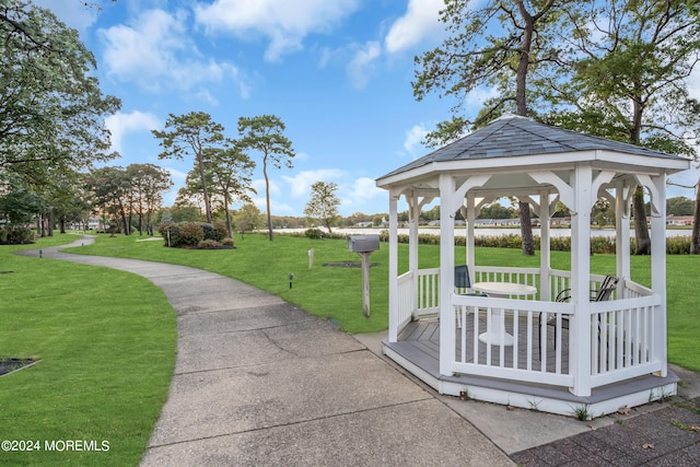 view of property's community with a gazebo and a lawn