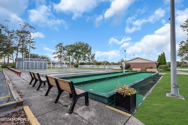 view of pool featuring a yard