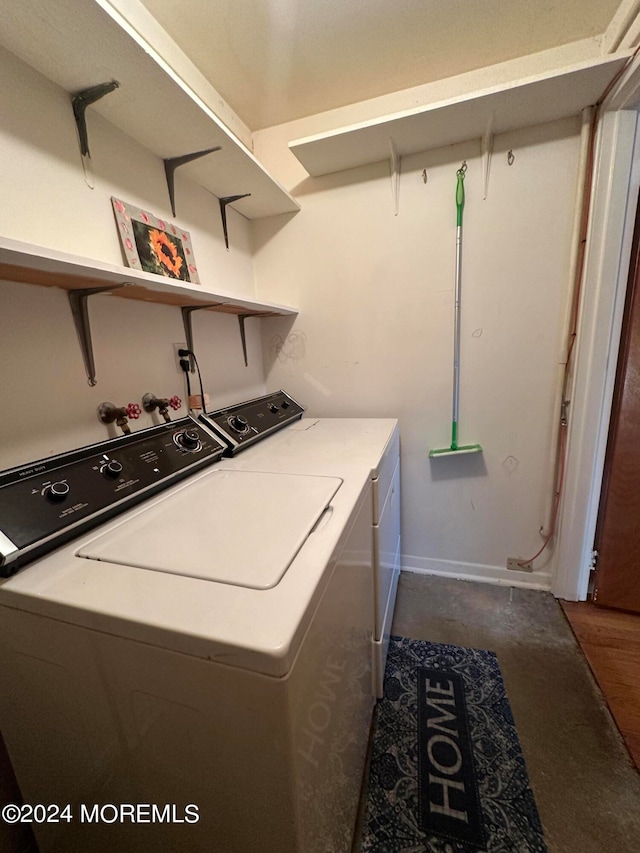 laundry room with washing machine and clothes dryer