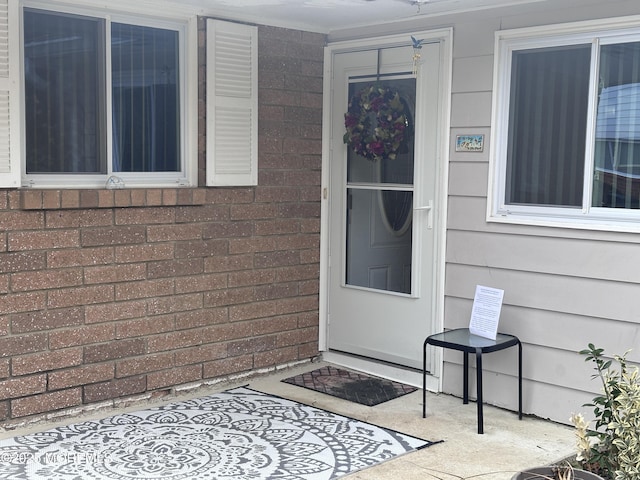 entrance to property with a patio