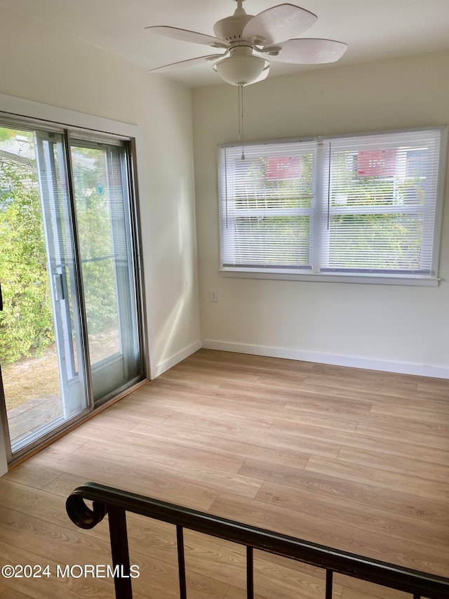 interior space with ceiling fan, light hardwood / wood-style flooring, and a wealth of natural light