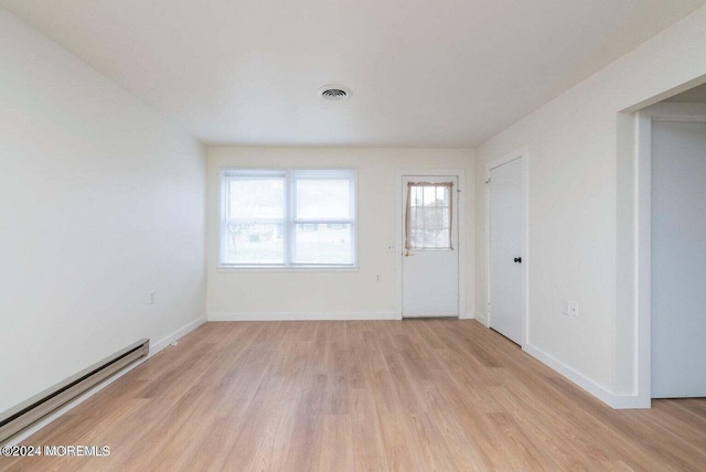 interior space with light hardwood / wood-style flooring and a baseboard radiator