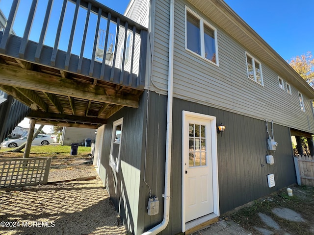 view of side of home featuring a deck