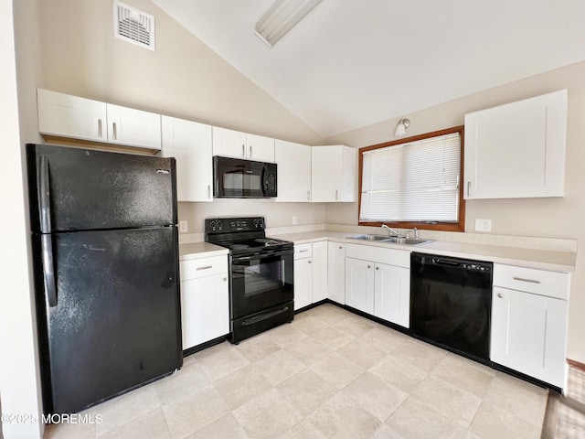 kitchen with black appliances, light countertops, visible vents, and white cabinetry