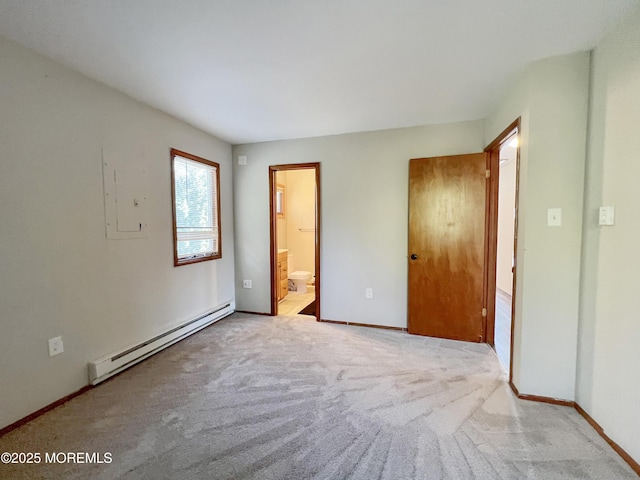 unfurnished bedroom featuring baseboards, baseboard heating, connected bathroom, and light colored carpet