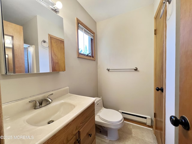 bathroom featuring toilet, tile patterned floors, a baseboard radiator, and vanity