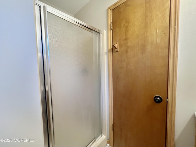 bathroom featuring an enclosed shower