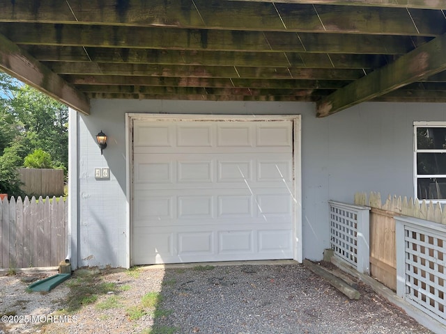 garage featuring fence