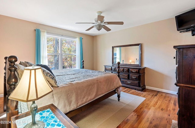 bedroom featuring light hardwood / wood-style flooring and ceiling fan