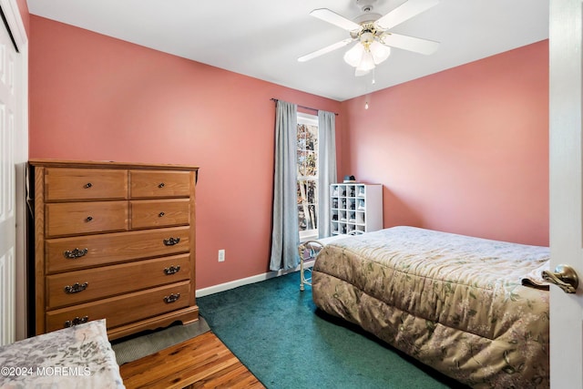 bedroom featuring dark wood-type flooring and ceiling fan