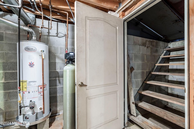 utility room featuring gas water heater