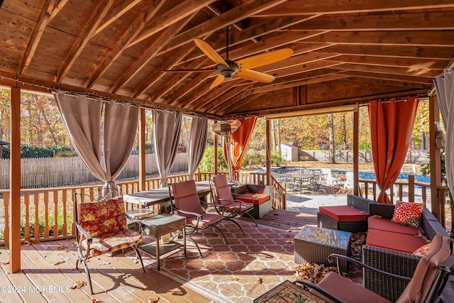 view of patio with a gazebo, an outdoor hangout area, a deck, and ceiling fan