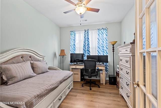 bedroom featuring light hardwood / wood-style flooring and ceiling fan