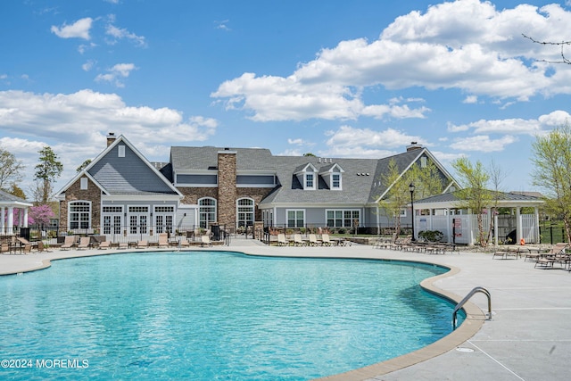 view of swimming pool with a patio