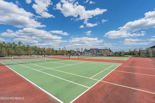 view of tennis court featuring basketball court