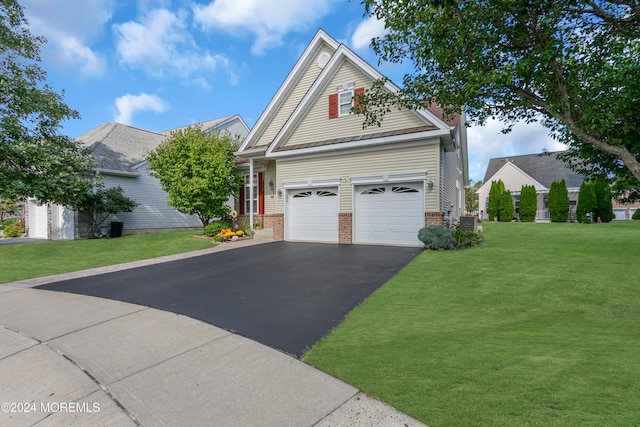 view of front facade with a front lawn and a garage