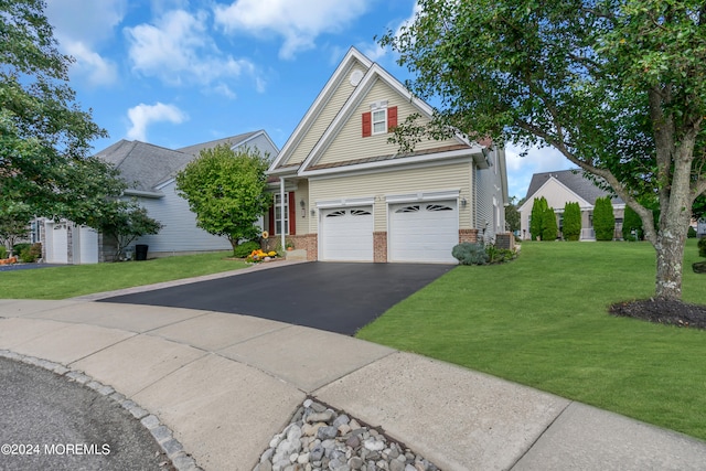 view of front facade with a front lawn and a garage