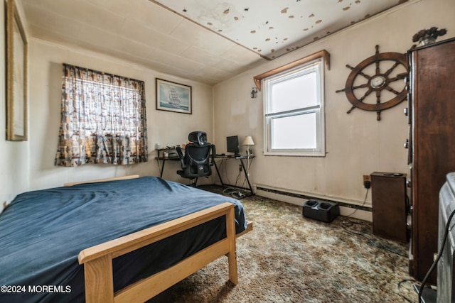 carpeted bedroom featuring baseboard heating