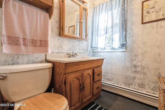 bathroom featuring a baseboard radiator, vanity, and toilet