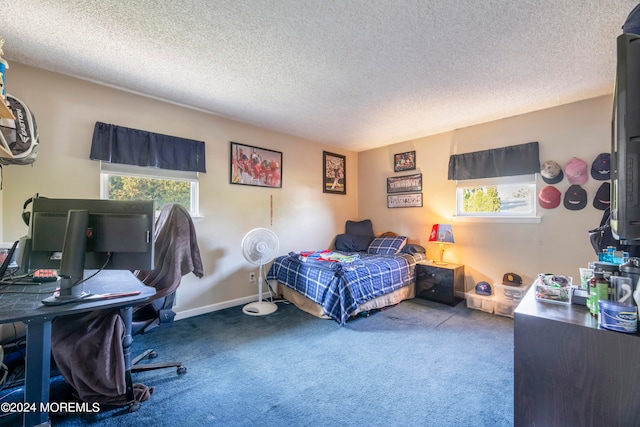 carpeted bedroom featuring a textured ceiling