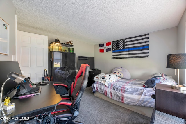 carpeted bedroom featuring a textured ceiling