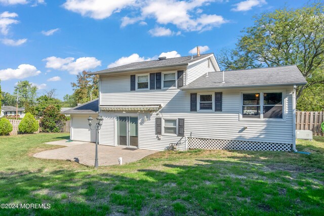 rear view of property with a patio area and a lawn