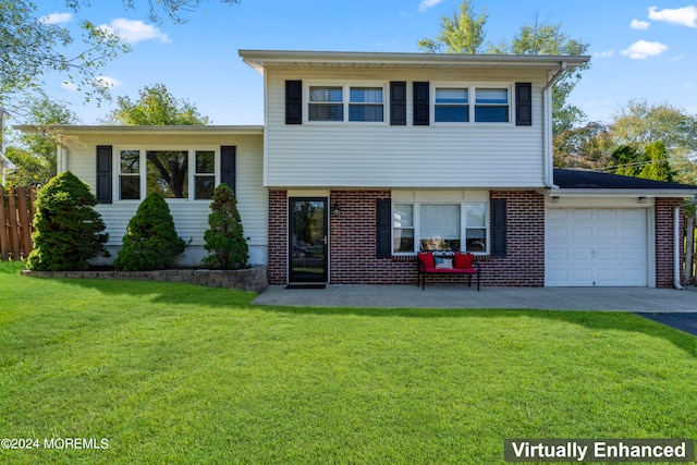 split level home with a front lawn and a garage