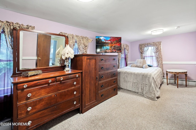 bedroom with carpet, baseboards, and baseboard heating