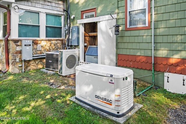 exterior details with ac unit, a power unit, and central AC unit