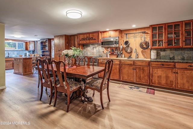 dining area featuring recessed lighting and light wood-style floors