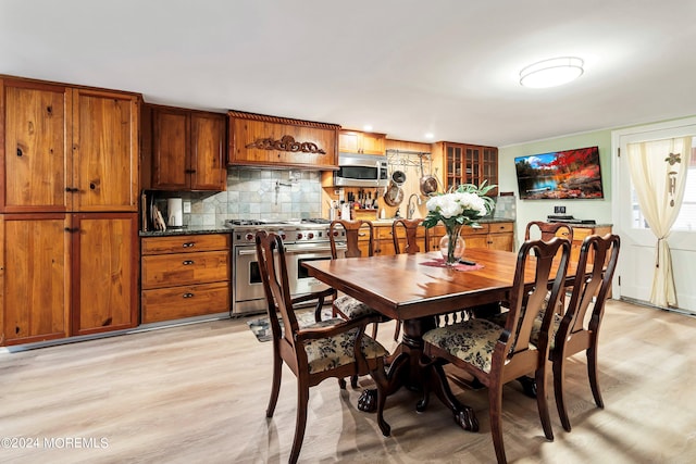 dining area with light wood-style floors