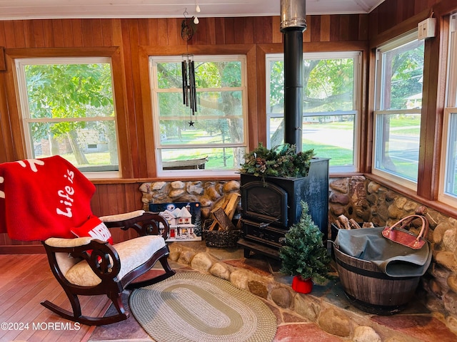 sunroom with a wood stove