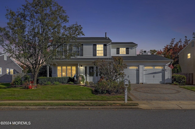 46 Markwood Dr, Howell, NJ 07731 - traditional home featuring decorative driveway, a yard, and an attached garage