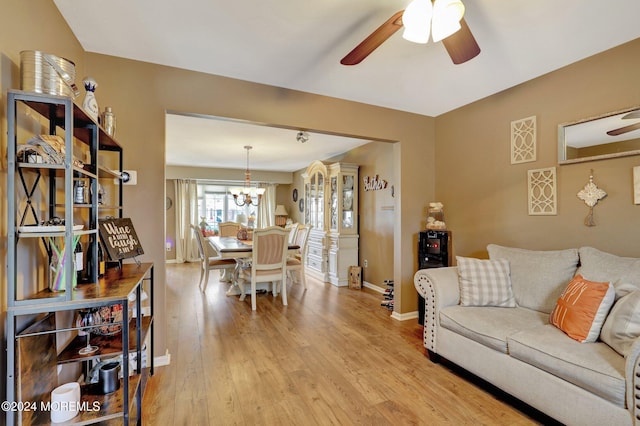 46 Markwood Dr, Howell, NJ 07731 - living area with baseboards, ceiling fan with notable chandelier, and light wood-style flooring