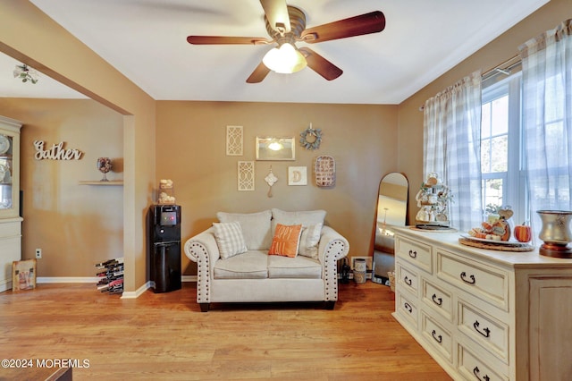 sitting room featuring ceiling fan and light hardwood / wood-style floors