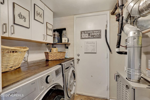 laundry room with cabinets and independent washer and dryer