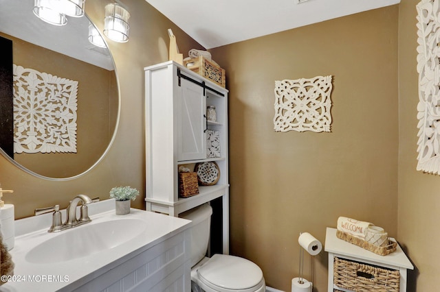 bathroom with vanity and toilet