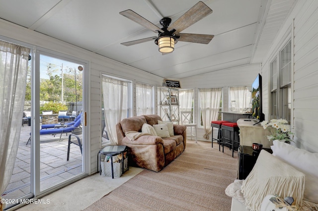 sunroom featuring a wealth of natural light, ceiling fan, and vaulted ceiling