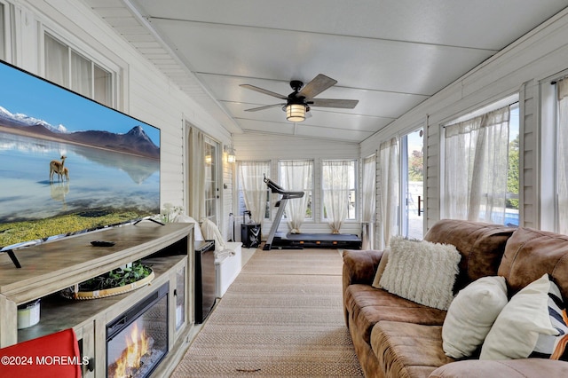 sunroom with vaulted ceiling and ceiling fan