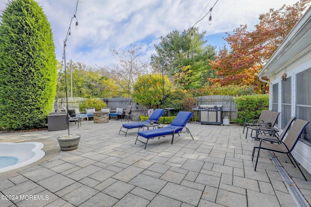 view of patio with a fire pit