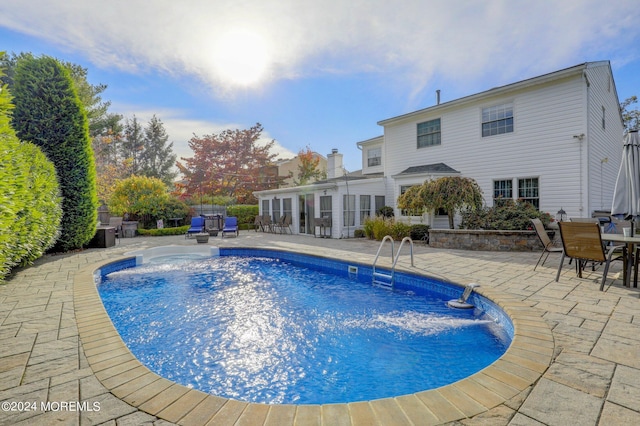 view of swimming pool featuring a patio