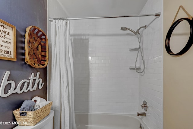 bathroom featuring toilet and shower / bath combo with shower curtain