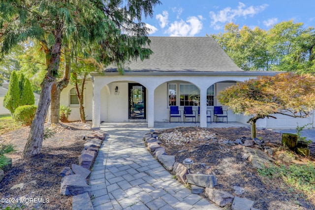 exterior space with a garage and a porch