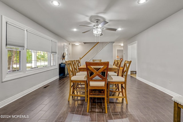 dining space featuring ceiling fan and dark hardwood / wood-style floors