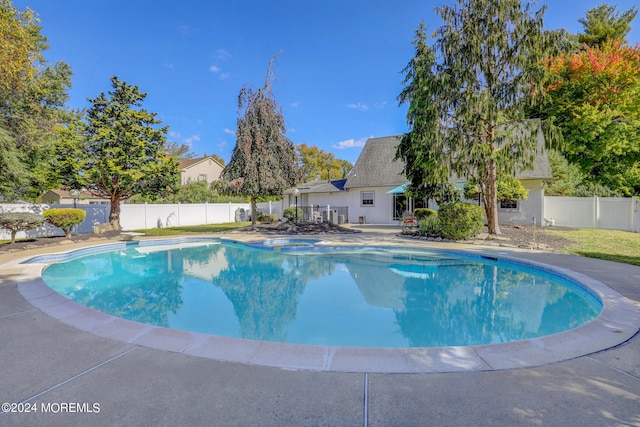 view of swimming pool with a patio area