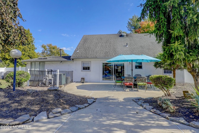 back of property with a patio area