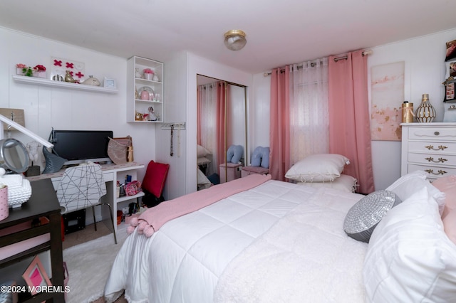 carpeted bedroom with a closet