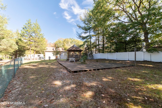 view of yard with a gazebo and a deck