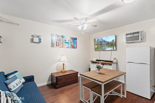 office space featuring an AC wall unit, ceiling fan, and dark hardwood / wood-style floors